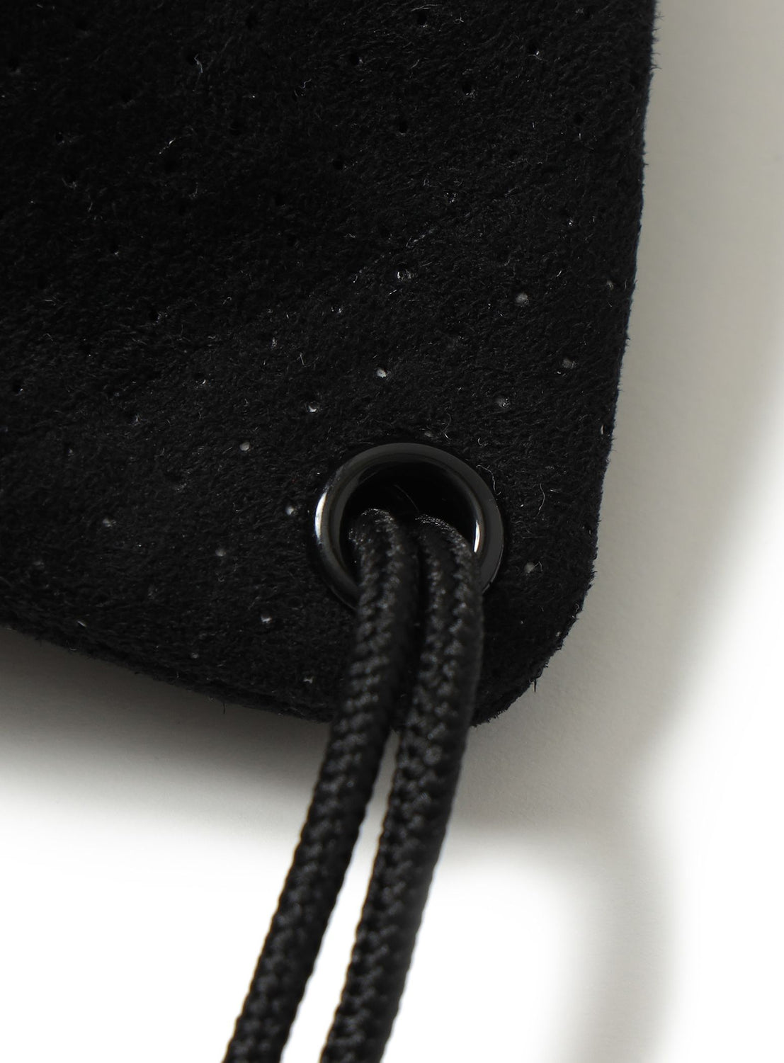 Perforated Drawstring Shoulder Bag